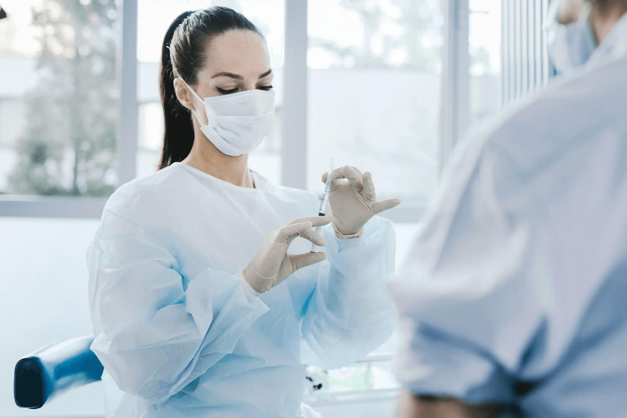 King Street Medical Centre nurse preparing a vaccine in a clinical setting