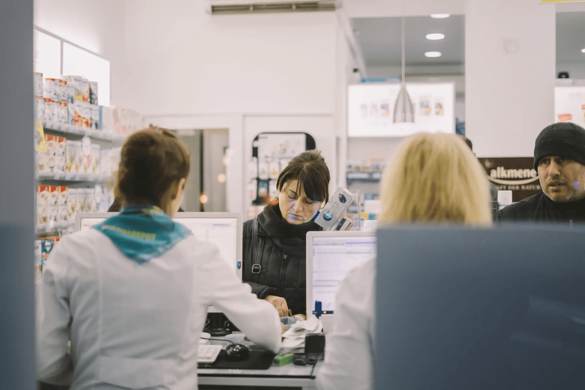 Pharmacist serving a patient at Bowmanville Guardian Pharmacy counter